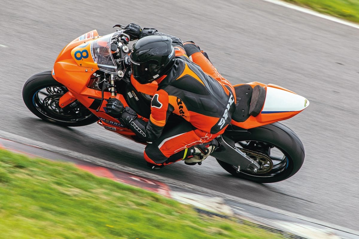 High angle shot of a rider going around a turn on the Kawasaki ZX-6R